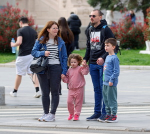 Young family waiting for traffic lights